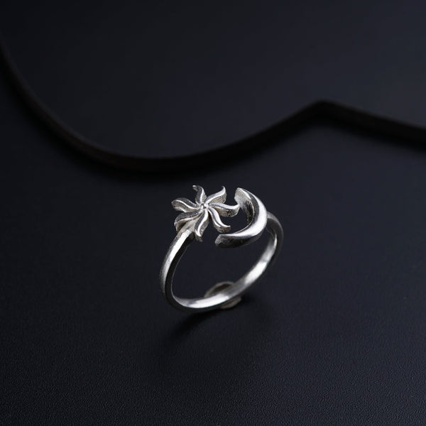 a close up of a ring on a black surface