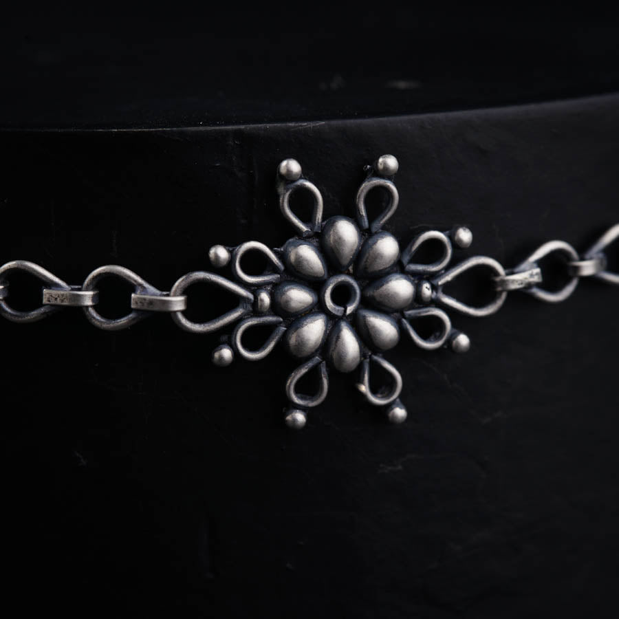 a close up of a belt with a snowflake on it